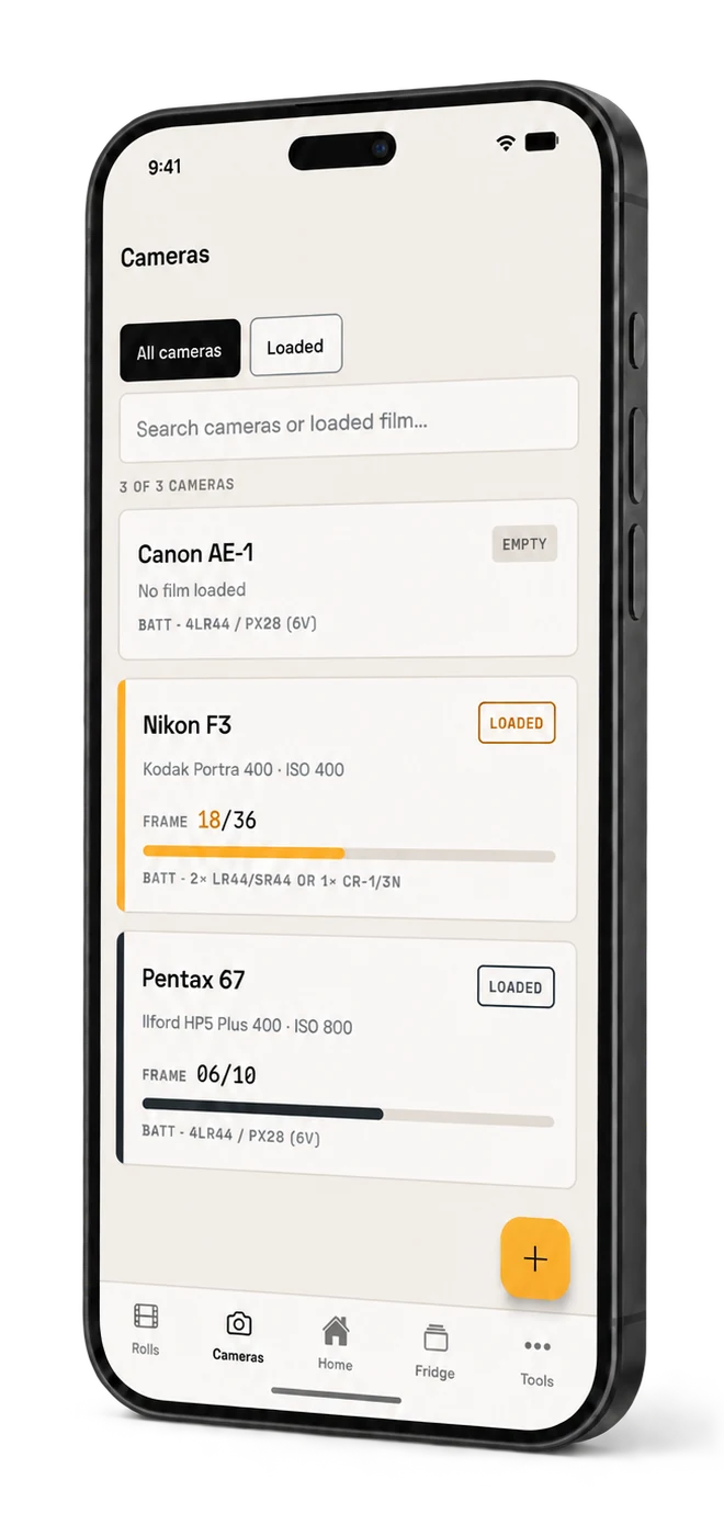 The camera shelf displayed on a black smartphone, listing three cameras. Two show a loaded film stock and frame progress; one is marked empty.
